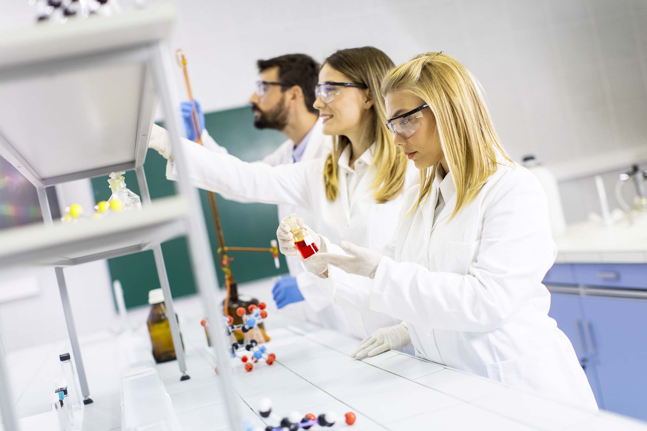 group-of-young-researchers-analyzing-chemical-data-XK57RCZ.jpg